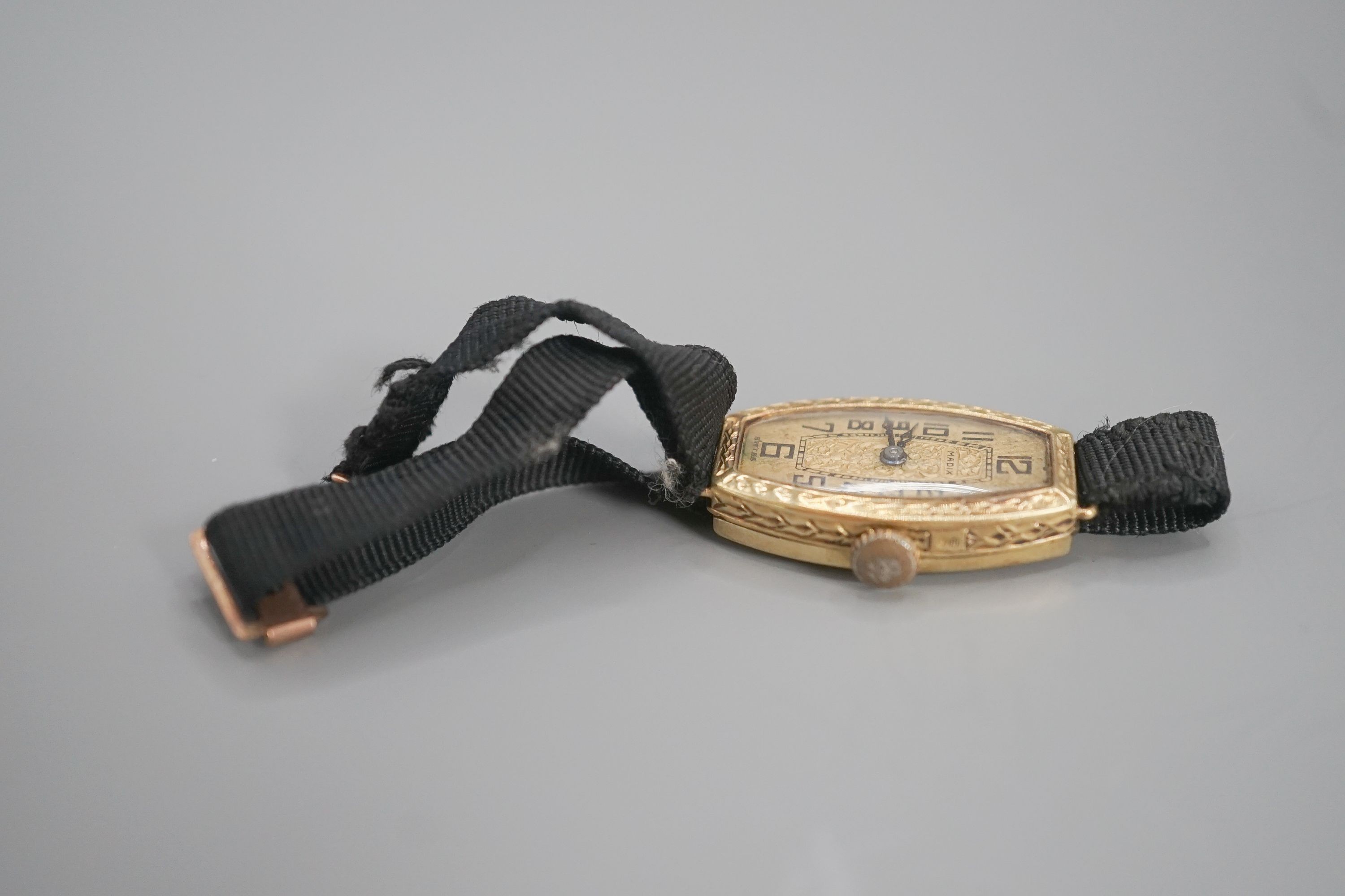 A lady's early 20th century 18ct gold manual wind wrist watch, case diameter 17mm, on a sash strap with 9ct buckle